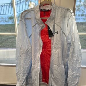 Under Armour silver/light blueish color with dark orange/light red stripe.